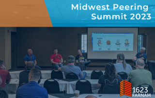 Attendees at the Midwest Peering Summit watch a panel